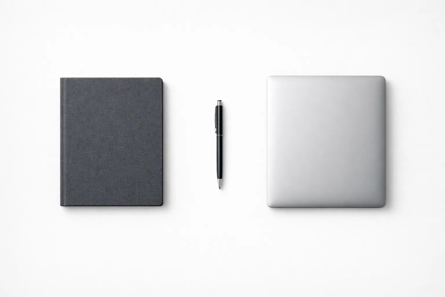 Organized workspace with a laptop and notebook representing a CMMC System Security Plan and POA&M documentation.